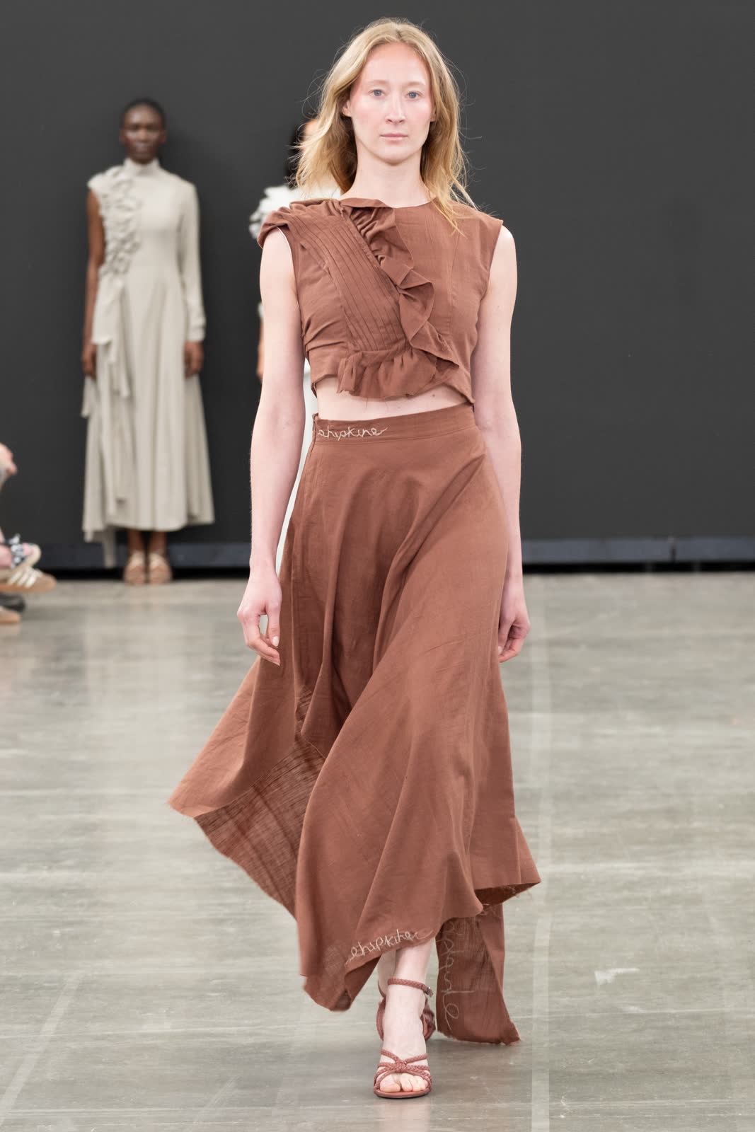 Look 06, rust linen ruffled crop and bias skirt. Photograph by Stone Clove.